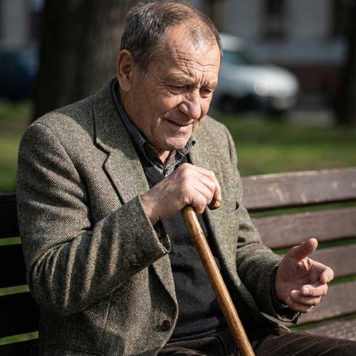 Senior with a cane transitioning from frustration to relief.